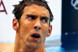Michael Phelps reacts after finishing fourth in the men's 400m individual medley.