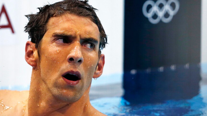 Michael Phelps reacts after finishing fourth in the men's 400m individual medley.