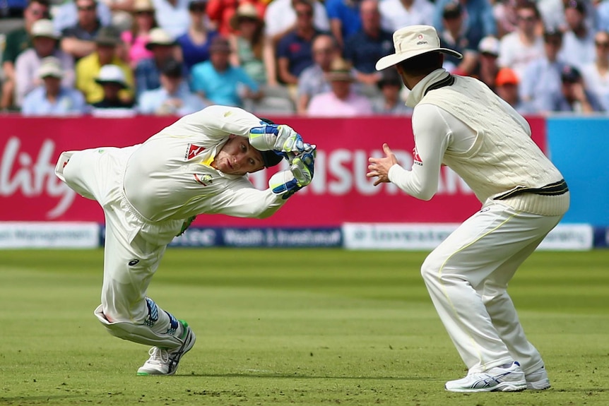 Peter Nevill dives for a ball during the Ashes