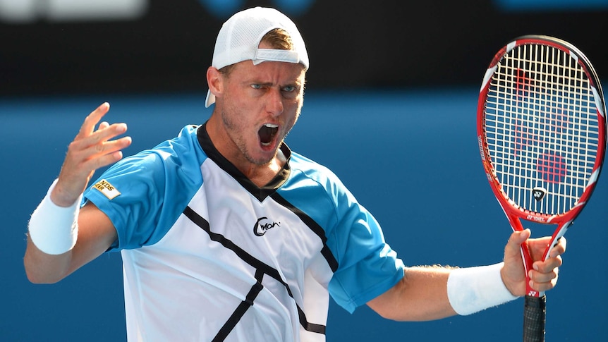 Lleyton Hewitt celebrates a point during Australian Open first round