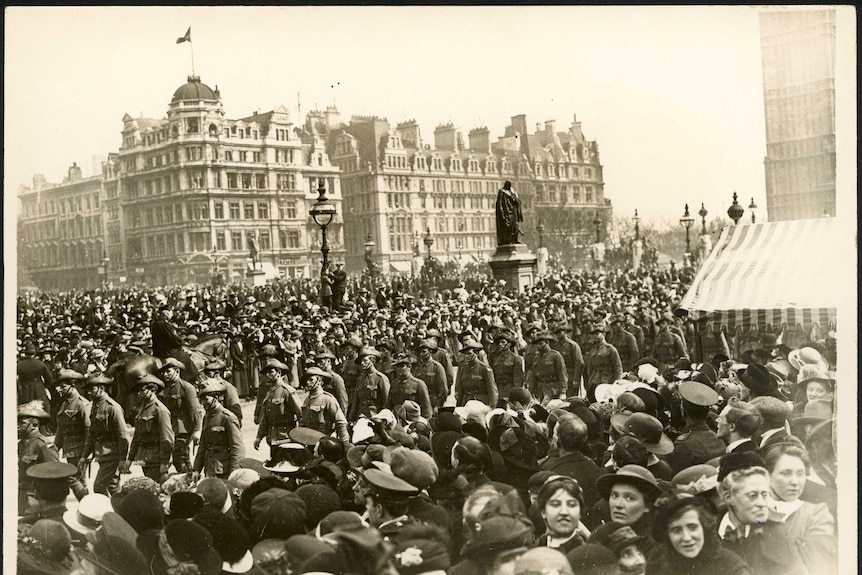 Large crowds gather to watch a march in Westminster.