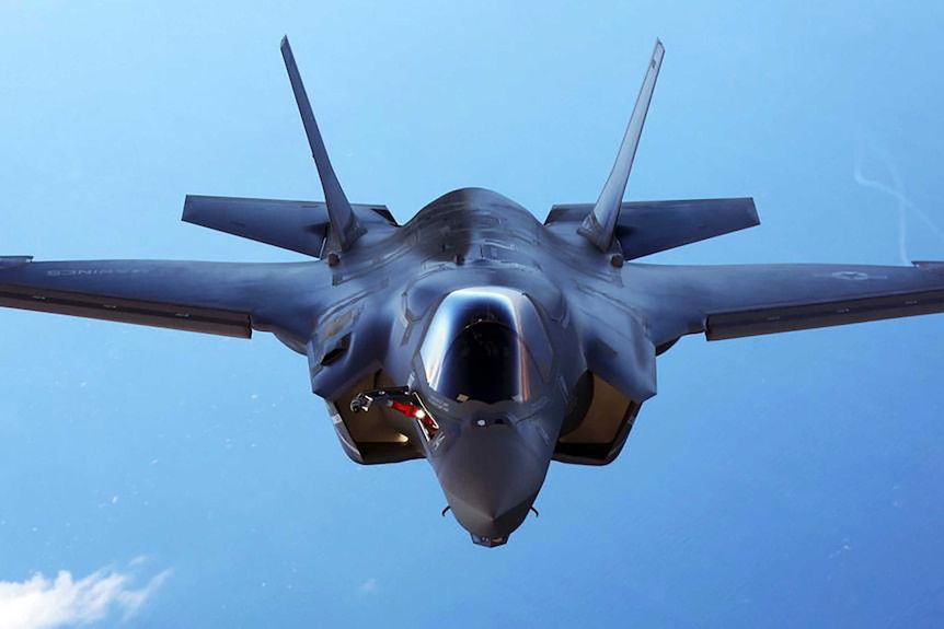 A F-35B joint strike fighter in flight is seen from above.