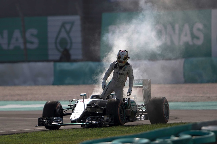 Lewis Hamilton leaves smoking car