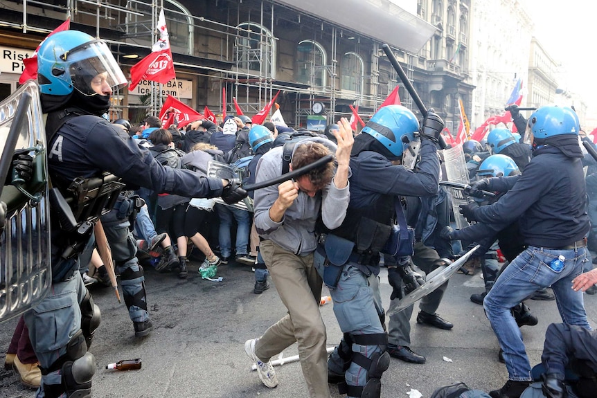 Demonstrators clash with policemen during a protest against austerity measures in downtown Rome April 12, 2014.