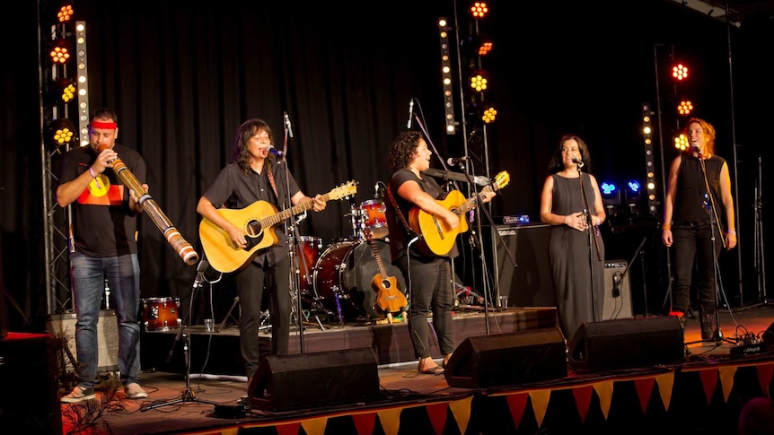 Performers on stage at Woodford