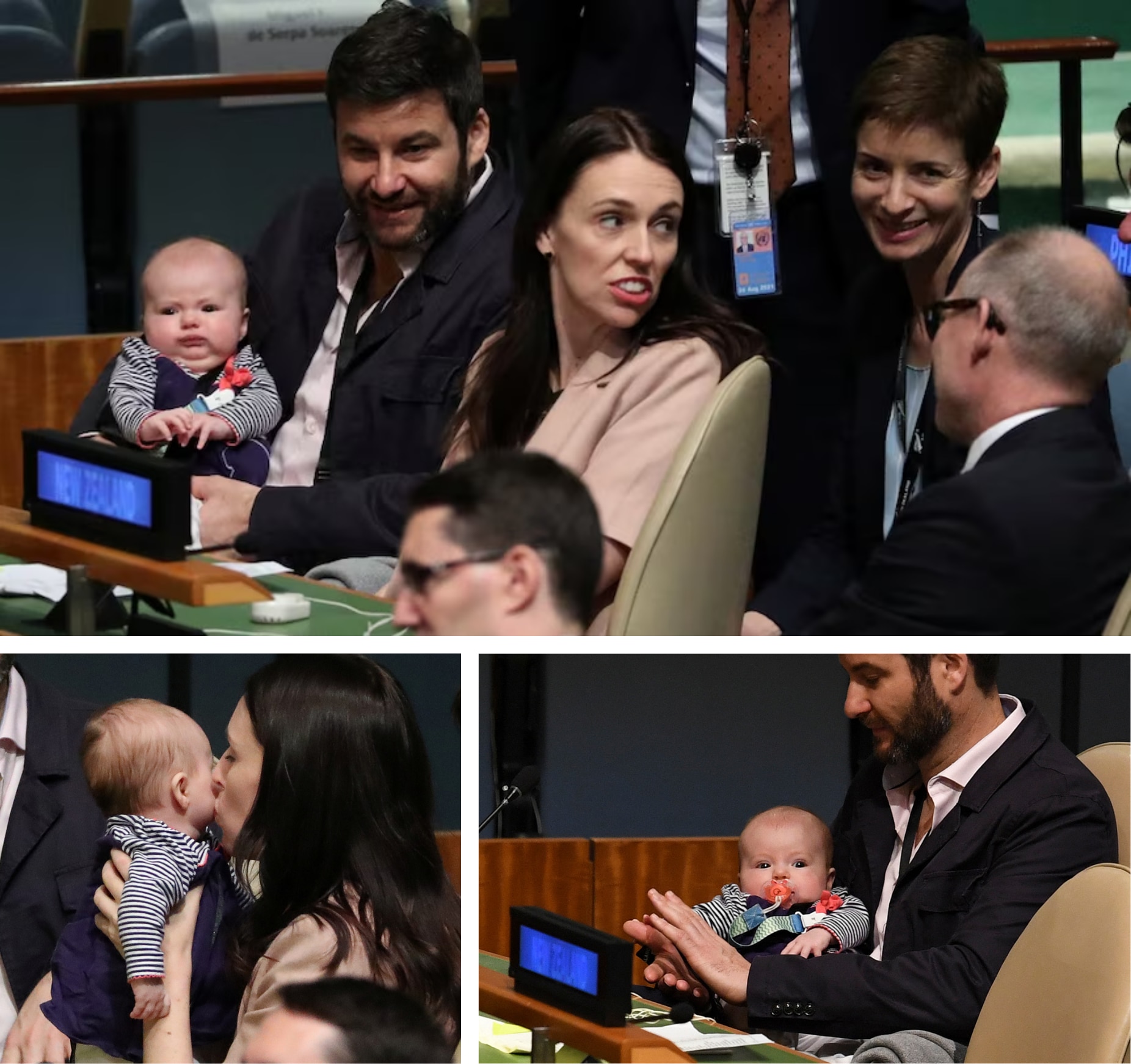 A man nurses an infant sucking a dummy and claps his hands