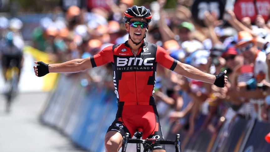 Richie Porte celebrates after crossing the finish line first at Willunga Hill.