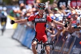 Richie Porte celebrates after crossing the line first at Willunga Hill in the 2016 Tour Down Under.