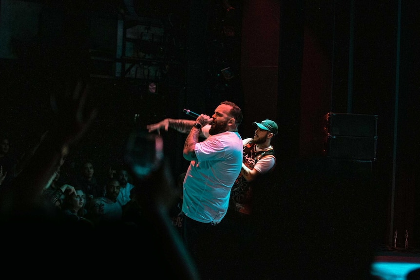 Colour photo of rappers Briggs and Nooky performing on stage at Sydney Opera House.