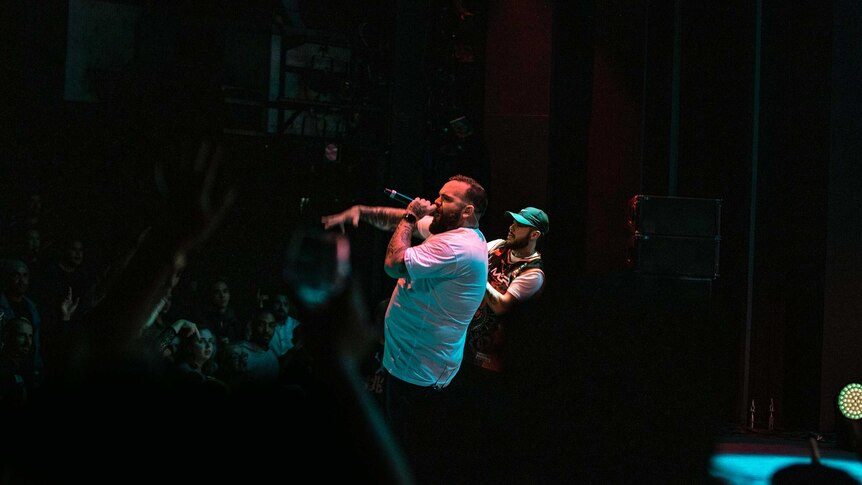Colour photo of rappers Briggs and Nooky performing on stage at Sydney Opera House.