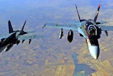 Two US fight jets fly over fields in Iraq