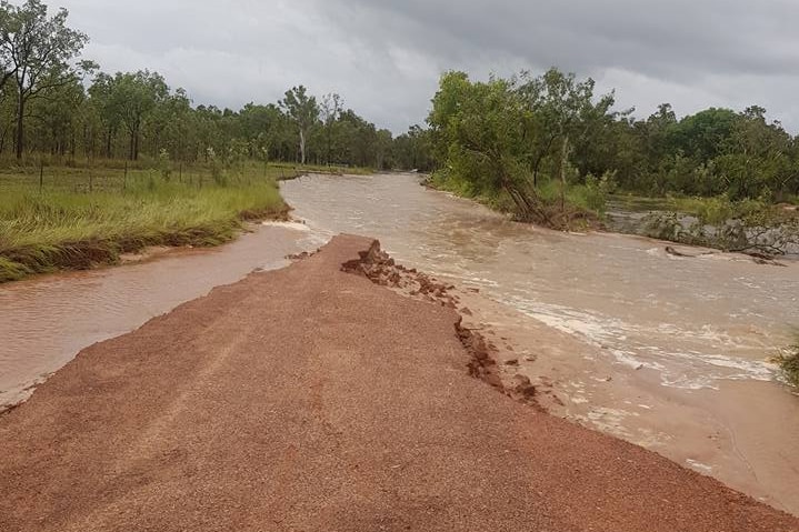 A dirt road covered in water.