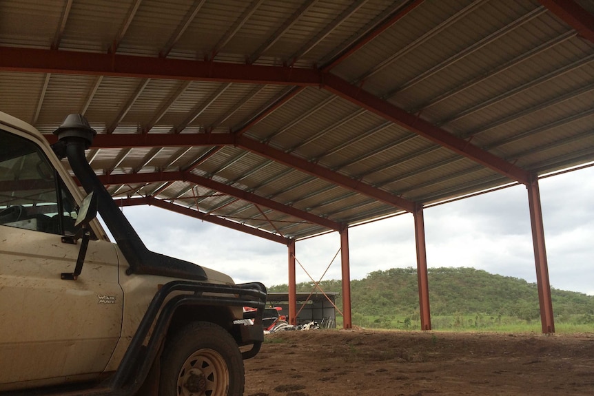 Landcruiser parked under shed