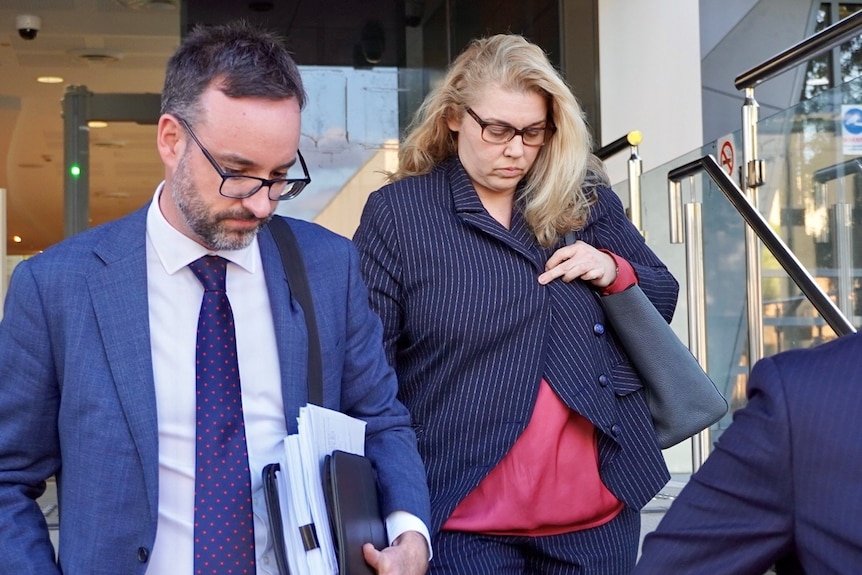 A woman walking out of court