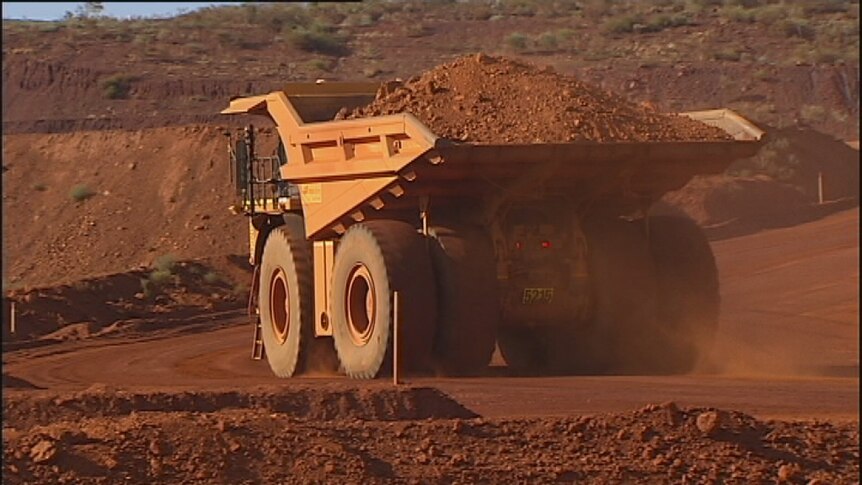 Giant mining truck carries ore in the Pilbara. April, 2014.