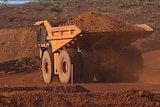 Giant mining truck carries ore in the Pilbara.