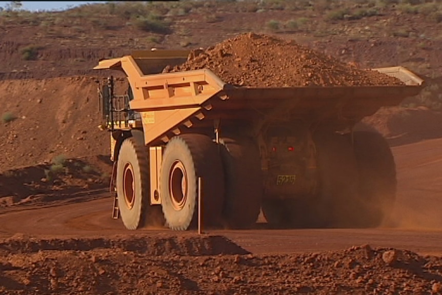 Giant mining truck carries ore in the Pilbara. April, 2014.