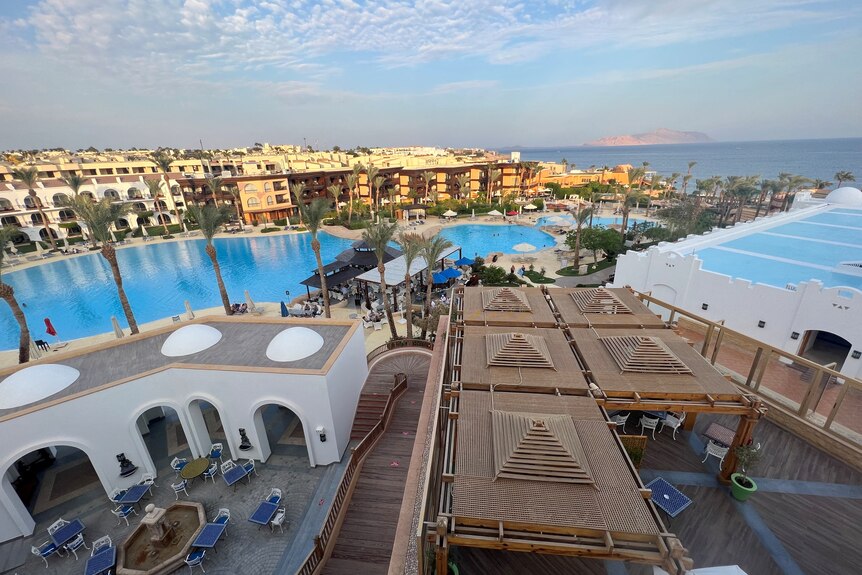 high up view of a hotel with pools in Egypt's Red Sea resort of Sharm el-Sheikh town