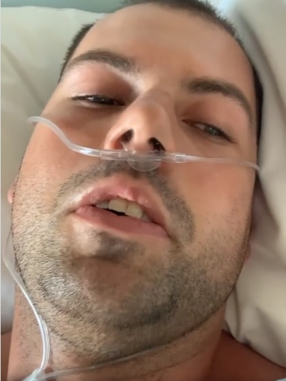 Charity cyclist and stroke survivor Tommy Quick in an Adelaide hospital bed.