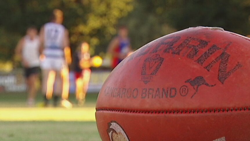 AFL football on ground at country footy training session