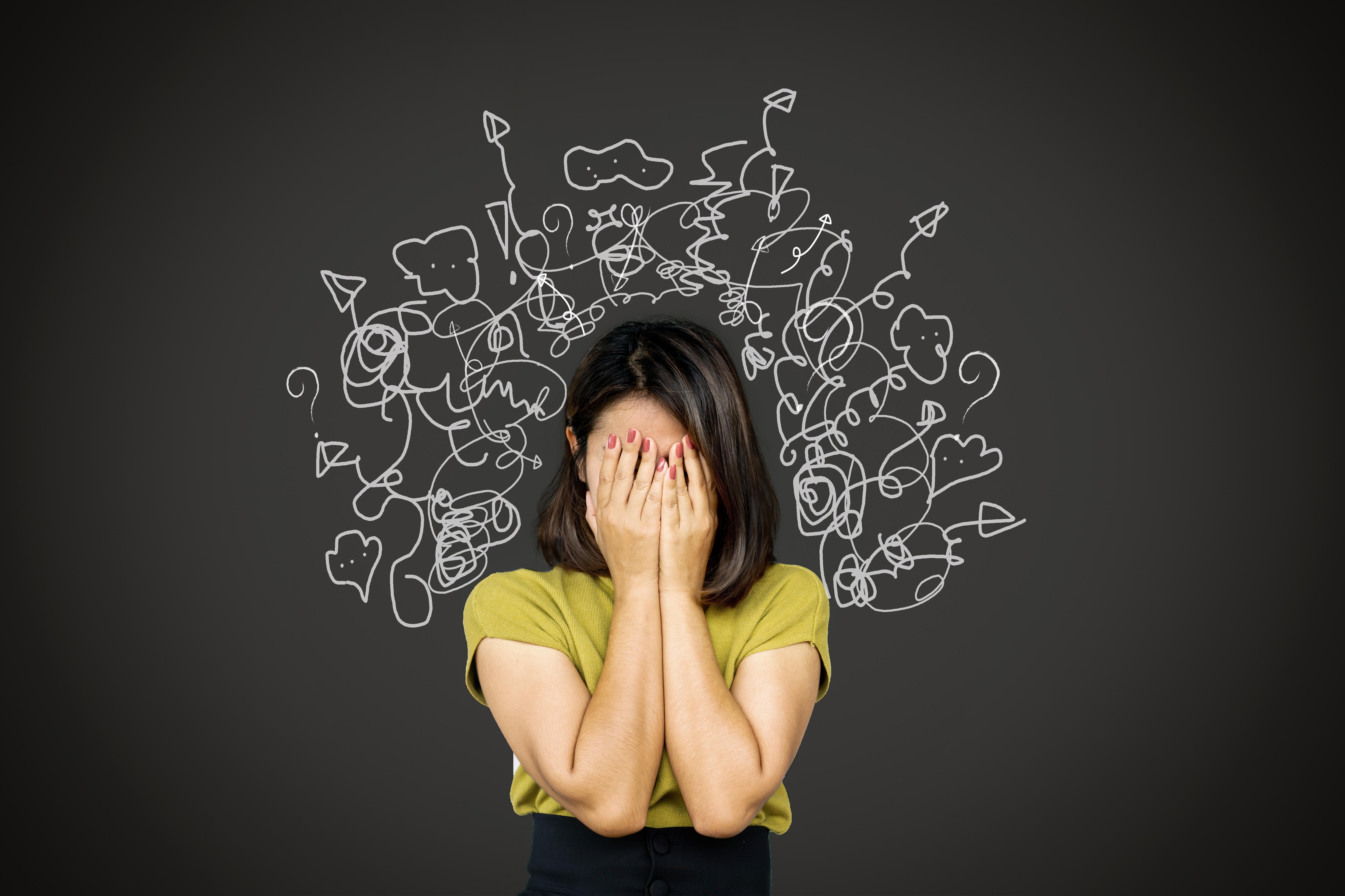 A woman looking overwhelmed and confused.
