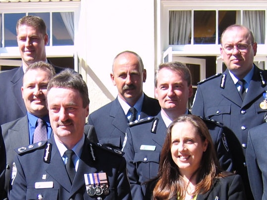 Frank Morgan stands for photo with others recognised in the Bali Honours