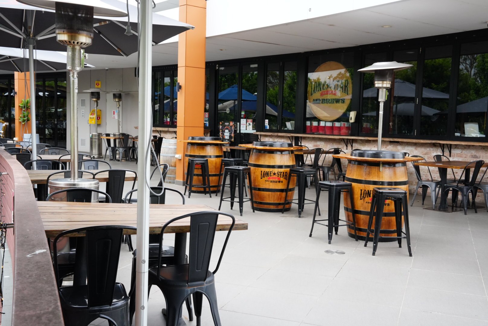 Images of Lone Star Rib House Brews Penrith's woodeen exterior on a cloudy day