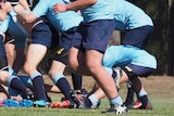 Schoolboy rugby players in a scrum