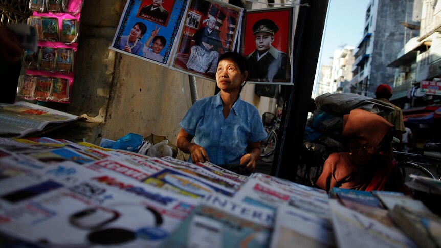 Burmese vendor sells newspapers in Rangoon