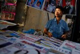 Burmese vendor sells newspapers in Rangoon