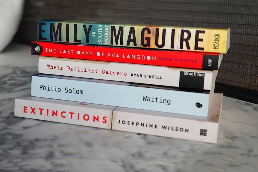 Miles Franklin Literary Award 2017 shortlisted books stacked up on a marble table.