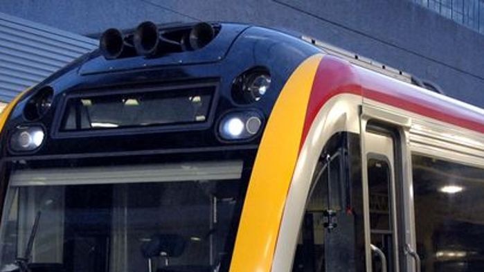 A Queensland Rail commuter train sits at Roma Street station in the Brisbane CBD