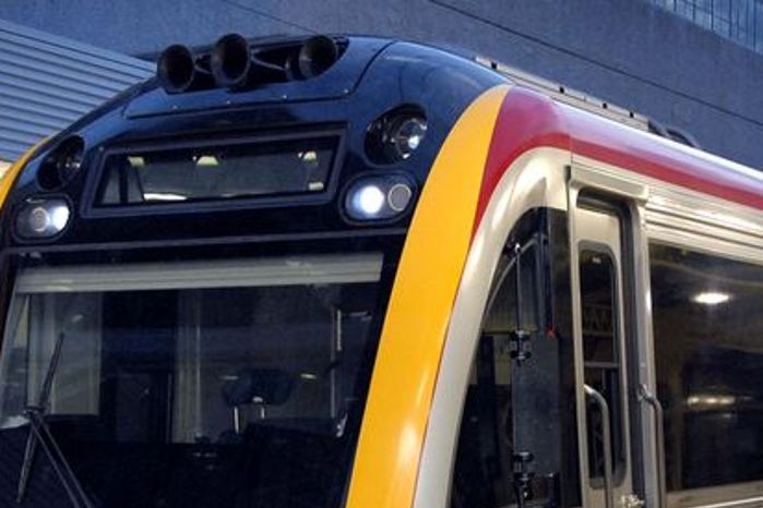 A Queensland Rail commuter train sits at Roma Street station in the Brisbane CBD