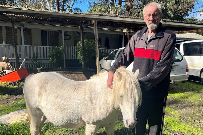 Francis Woodhouse in front of his house with pony