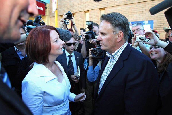 Press pack surrounds Prime Minister Julia Gillard as she is confronted by Mark Latham