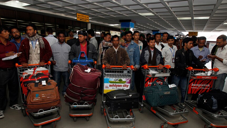 Bangladeshi migrant workers in Dhaka airport.