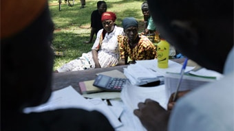 Women wait to get a microcredit loan in Kenya (AFP/Roberto Schmidt)