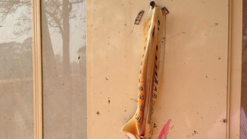 A thermometer on the outside of a house in Winmalee is melted due to heat from a bushfire.