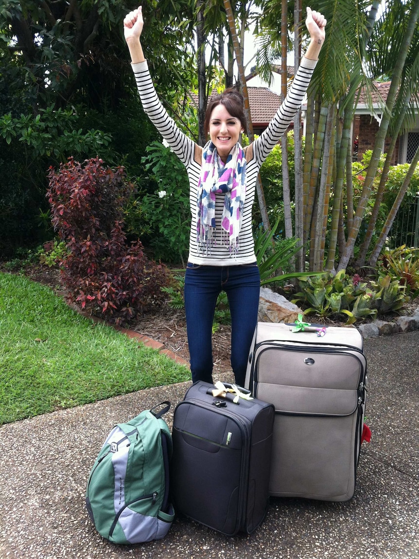 Imogen Brennan with her suitcases, prior to moving to London in 2011.