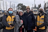 Rachel Lehmann-Ware and husband Duncan with masked people.