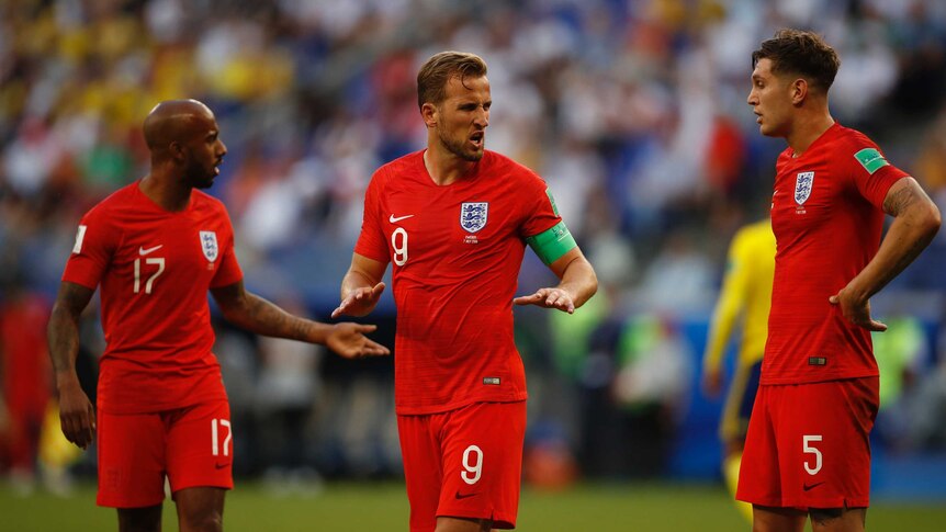 Harry Kane talks to teammates during World Cup quarter-final