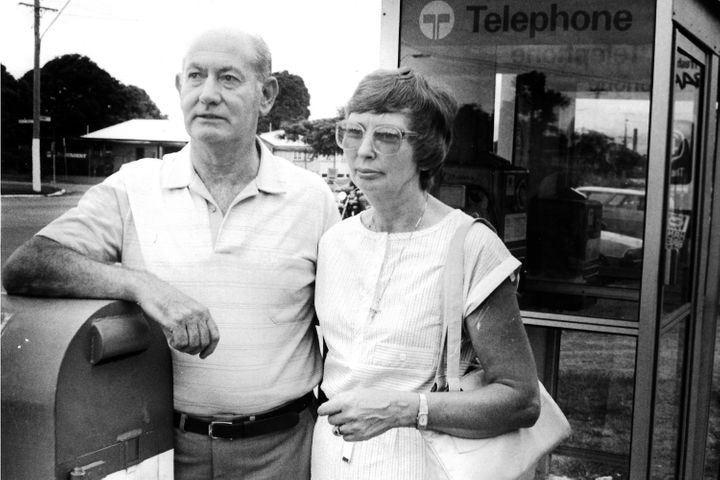 Black and white image of Tony Jones's parents Kevin and Beres Jones standing near a phone box