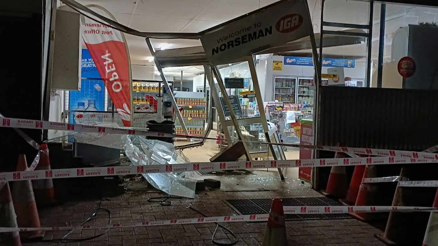 Damage at the front of a supermarket after a ram raid.