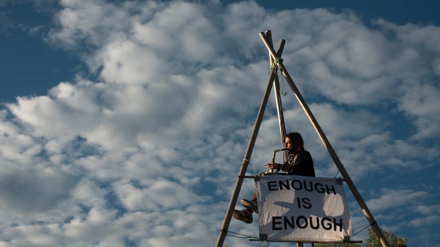 An activist blockades the construction of the Maules Creek coal mine project in north-west NSW.
