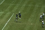 Diego Maradona handles the ball past Peter Shilton