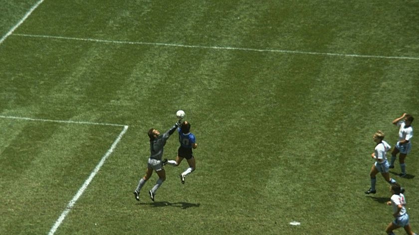 Diego Maradona handles the ball past England goalkeeper Peter Shilton to score the opening goal - famously referred to as the 'hand of god' goal - of the World Cup quarter-final in June 1986.