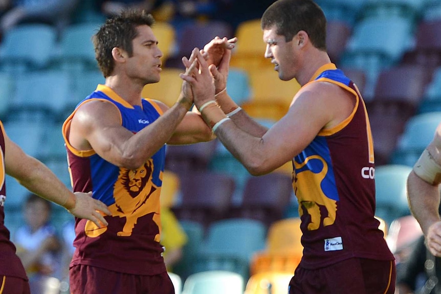 Simon Black and Jonathan Brown congratulate each other after a goal.