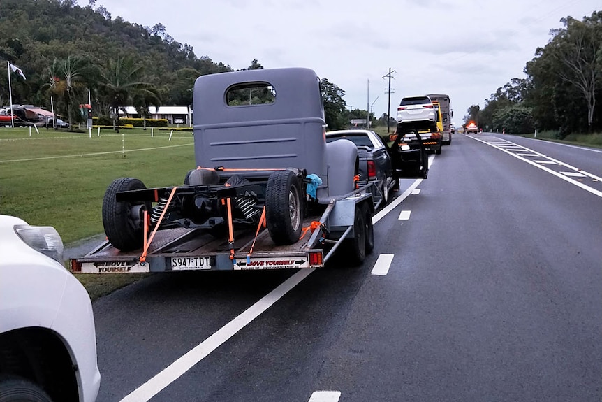 Traffic lined up on closed Bruce Highway at Crystal Creek north-west of Townsville due to flooding