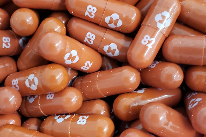 A collection of pills with 82 written on them.