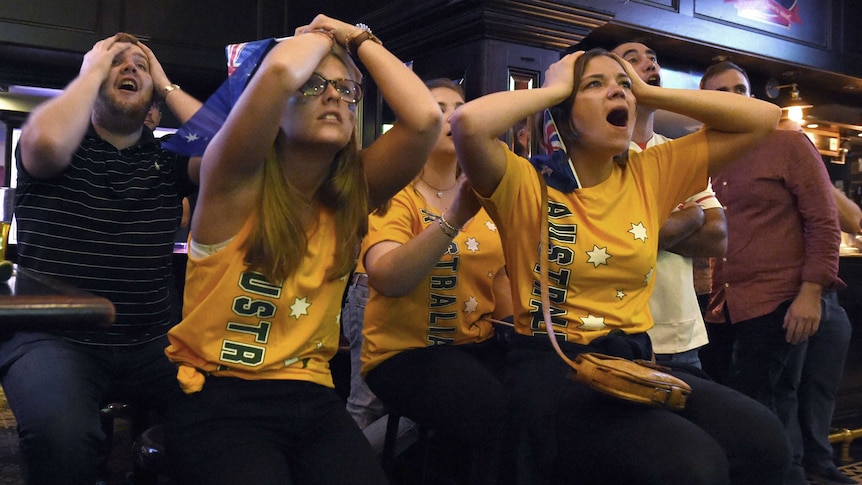 Australian fans watch the Australian Wallabies lose to the New Zealand All Blacks